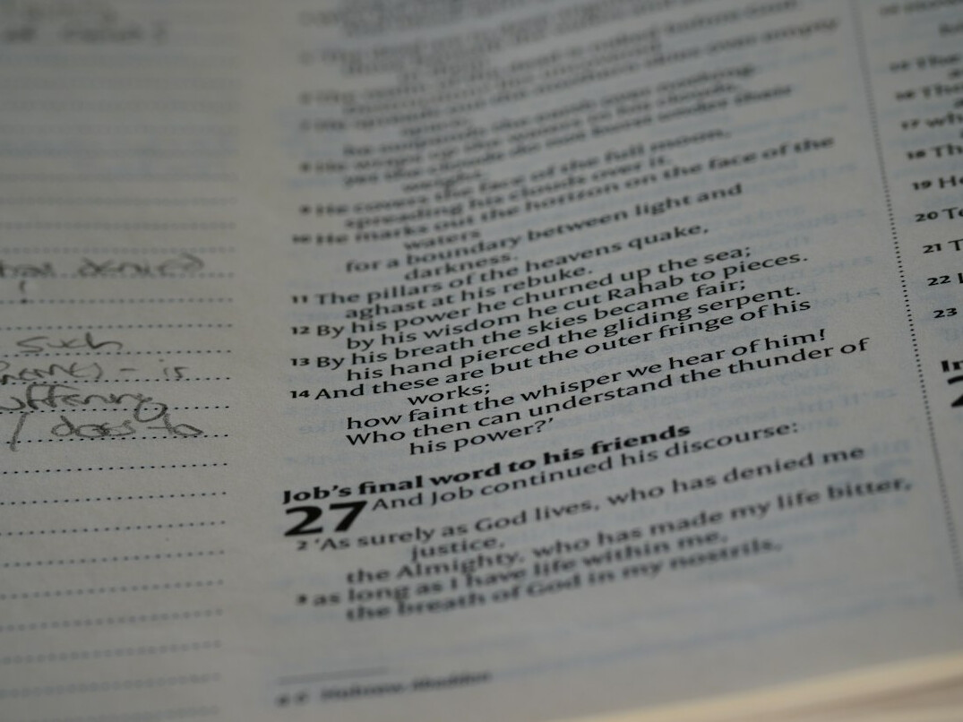 Notebook with handwritten plan and pen on a desk