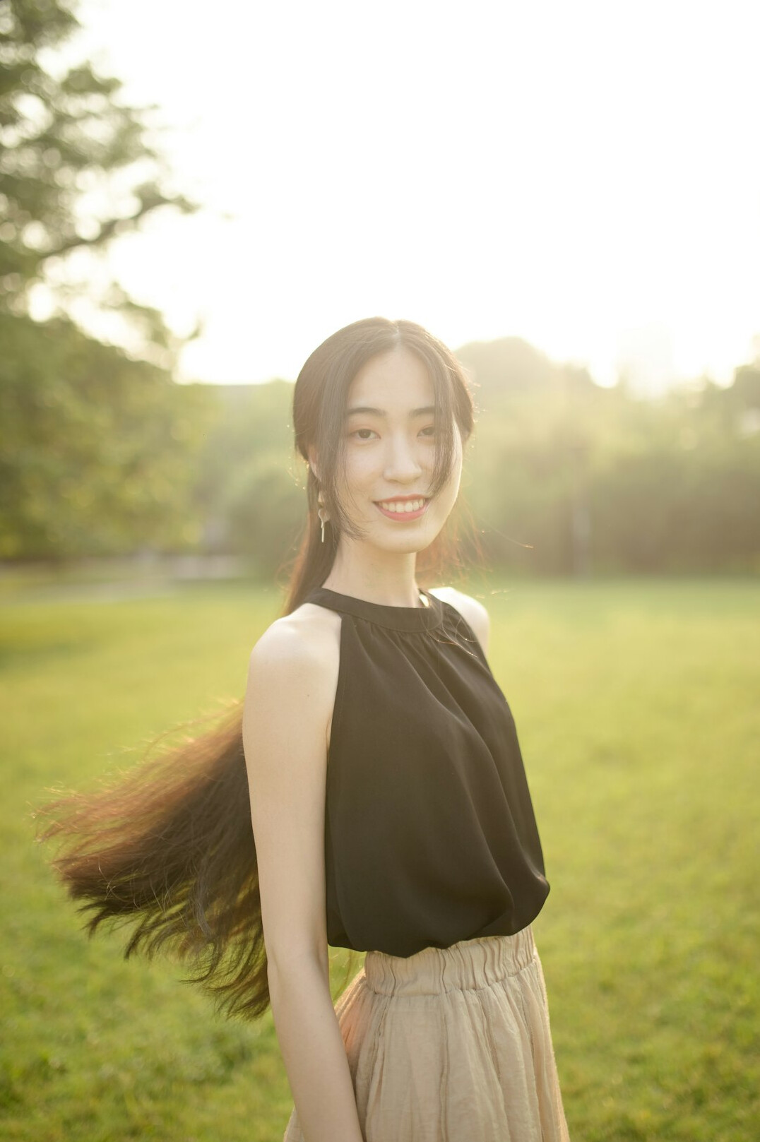 Portrait of a woman with long brown hair smiling